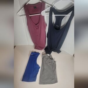 Random Sizes In Women's Muscle Tees in Rose, Navy, Blue, and Gray